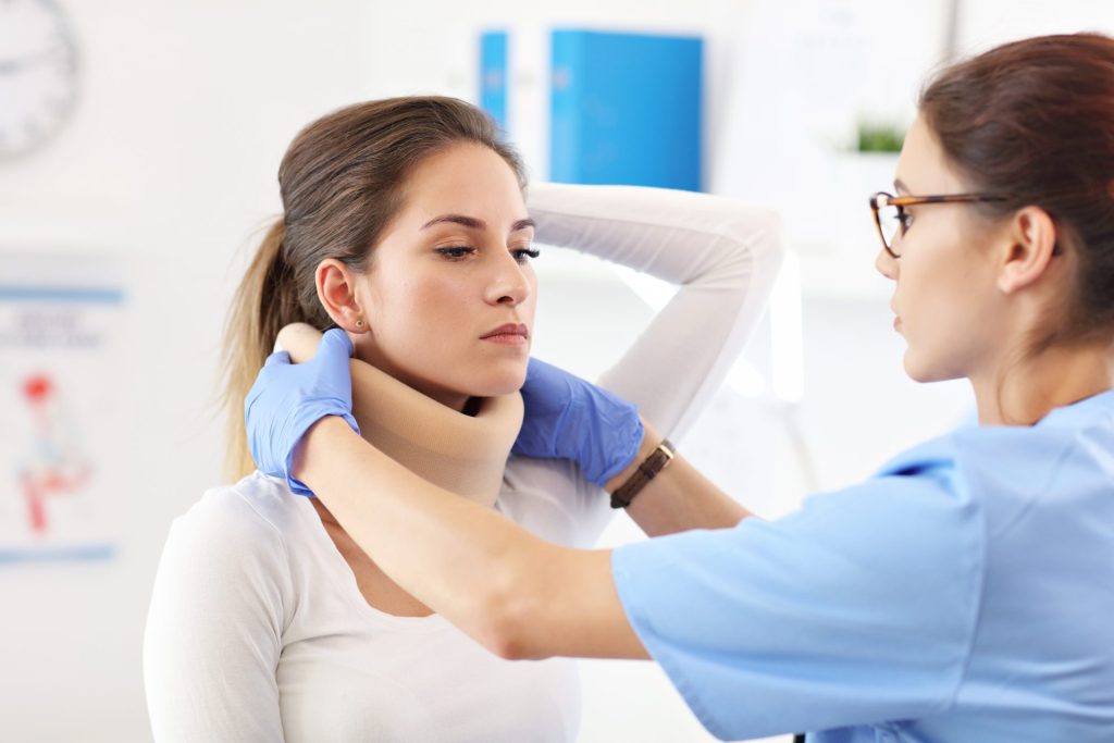 A woman is being examined by a doctor.